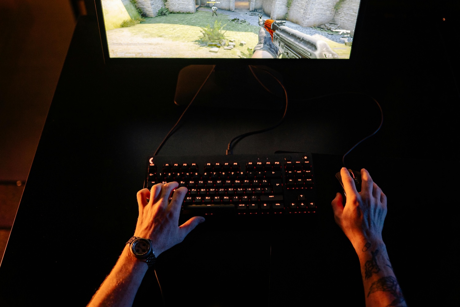 A young boy playing video games at a desk