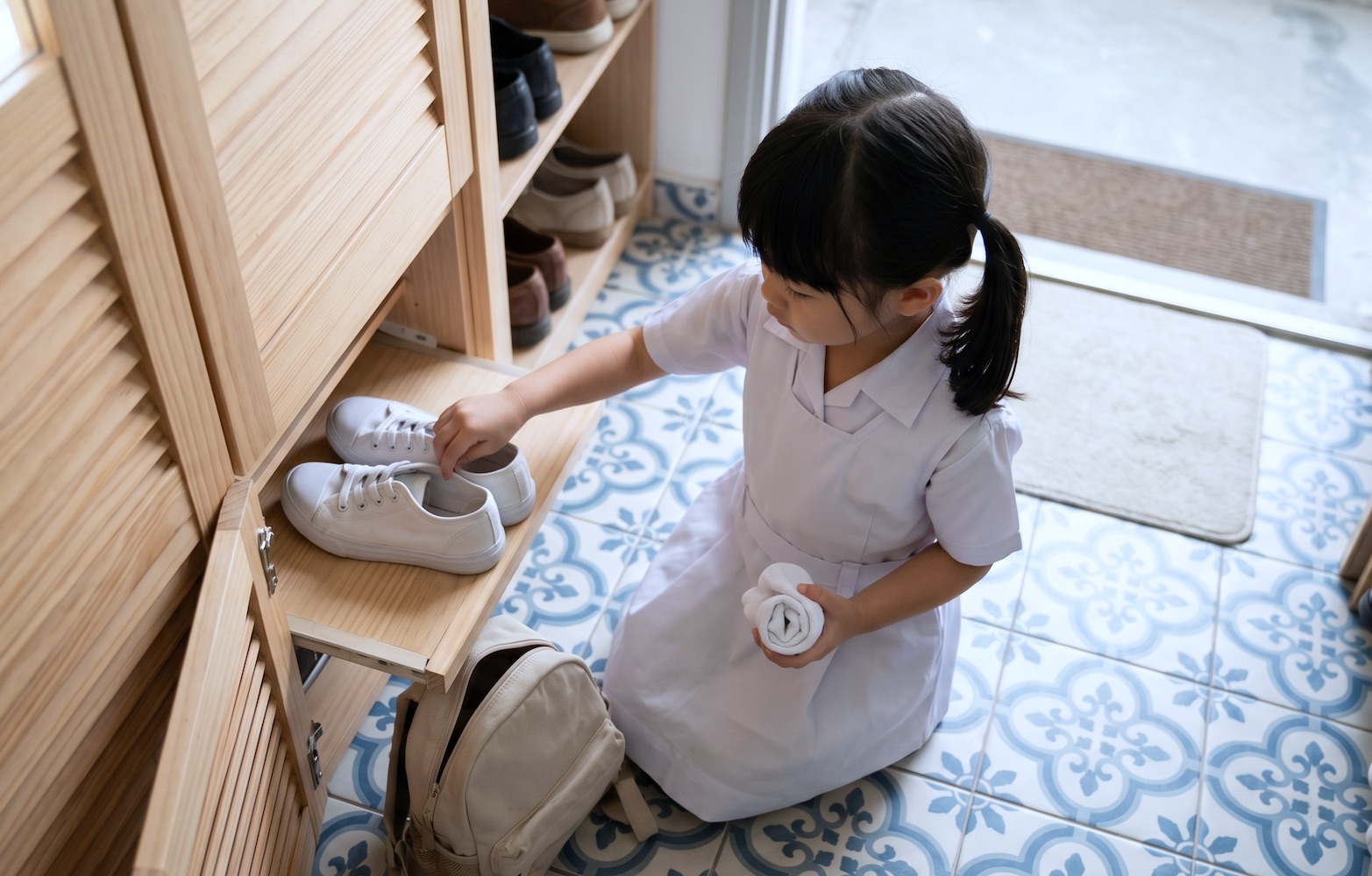 Fine motor difficulty with socks leads to frustration, and tight shoe velcro makes the task feel impossible.